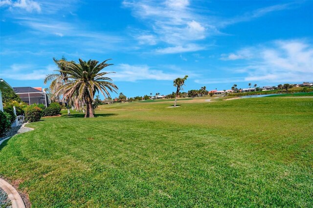 507 Monaco Dr, Punta Gorda, FL 33950 - view of property's community featuring a water view, a yard, and view of golf course