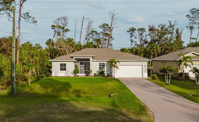 ranch-style home with driveway, a garage, a front lawn, and stucco siding