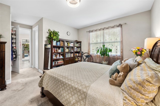 bedroom featuring light colored carpet