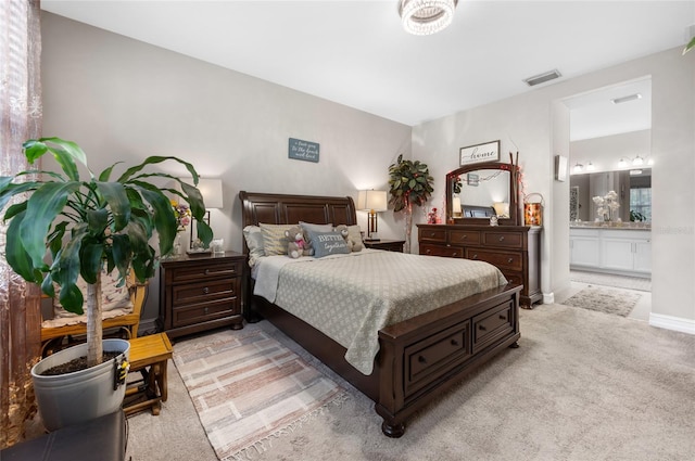 bedroom featuring light carpet, connected bathroom, visible vents, and baseboards