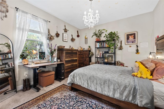 bedroom with a chandelier, carpet, and baseboards