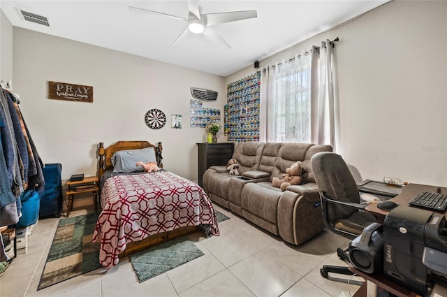 bedroom with light tile patterned floors, visible vents, and a ceiling fan