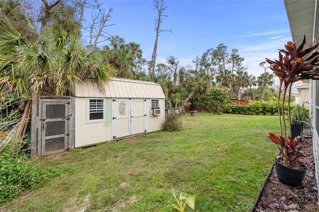 view of yard featuring a storage unit, an outdoor structure, and cooling unit