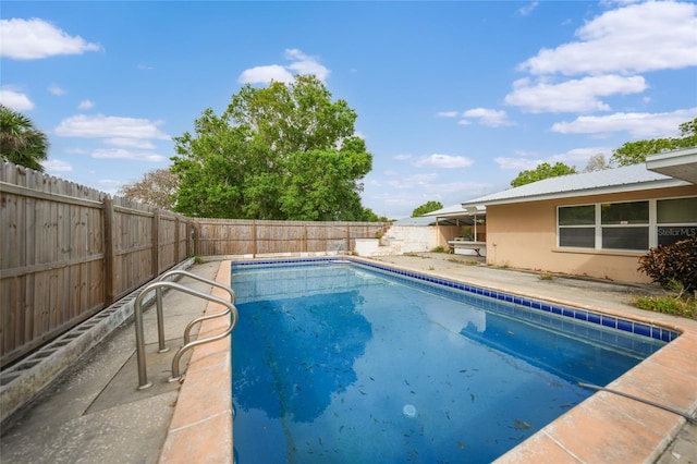 view of pool with a fenced backyard, a fenced in pool, and a patio