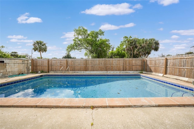 view of swimming pool featuring a fenced in pool and a fenced backyard