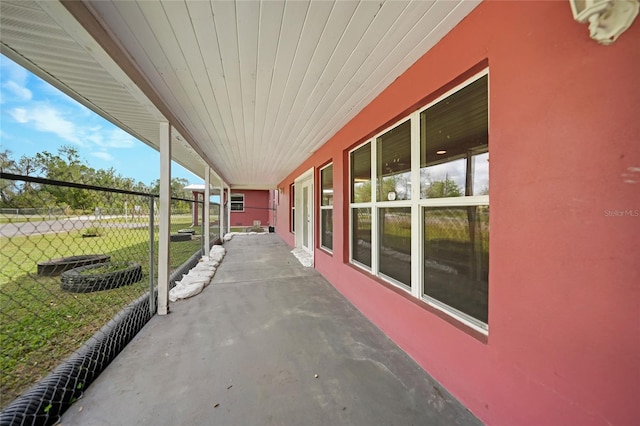 view of patio featuring fence