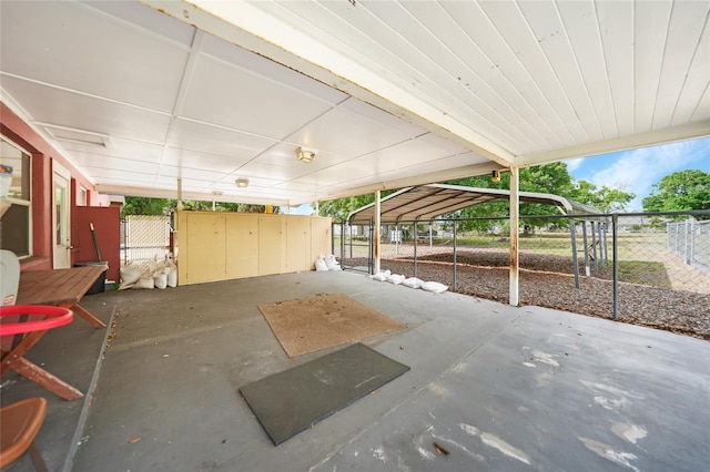 view of patio featuring a gate and fence