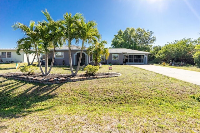 ranch-style home with stucco siding, concrete driveway, and a front yard