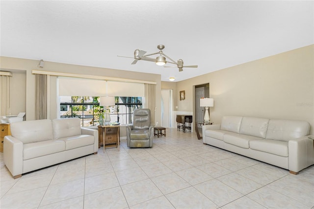 living room featuring light tile patterned flooring and a ceiling fan