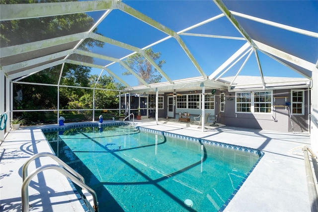 pool with a patio area, a lanai, and ceiling fan