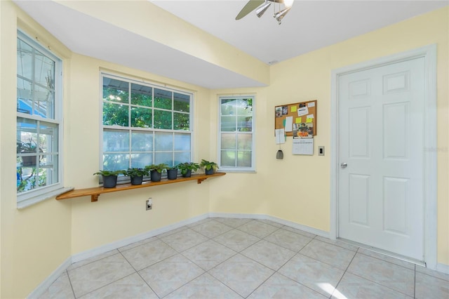 interior space with plenty of natural light and ceiling fan