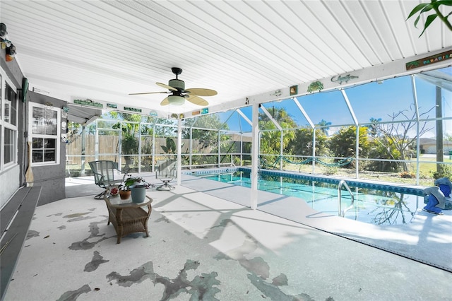 outdoor pool with a patio area, glass enclosure, ceiling fan, and fence