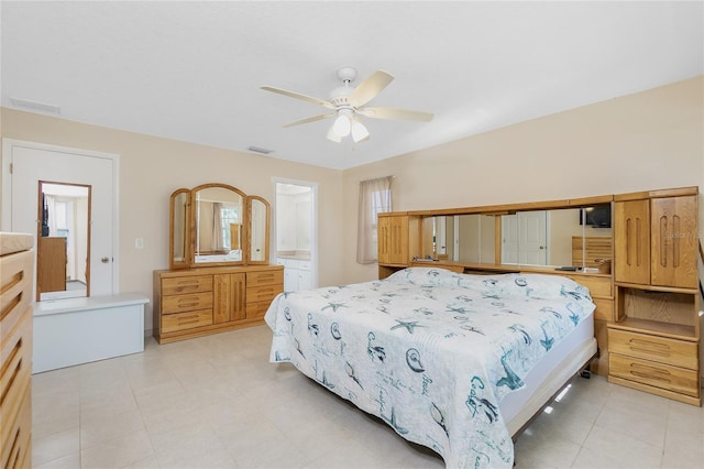 bedroom featuring visible vents, connected bathroom, and a ceiling fan