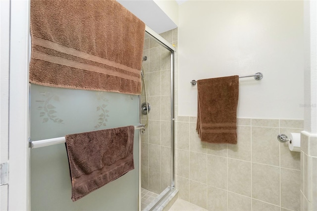 bathroom with a shower stall