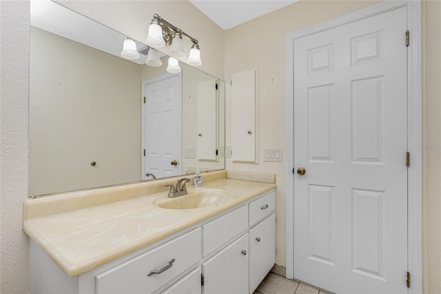 bathroom with tile patterned floors and vanity