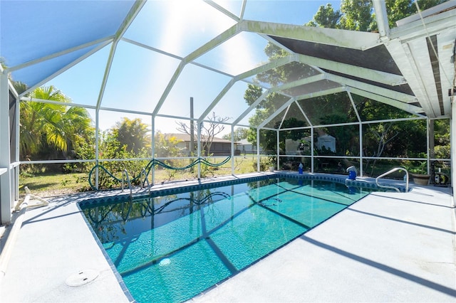 pool with a patio area and a lanai