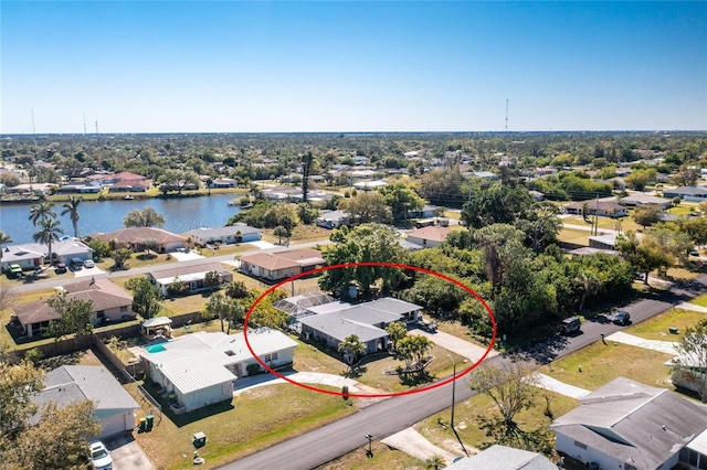 bird's eye view with a residential view and a water view