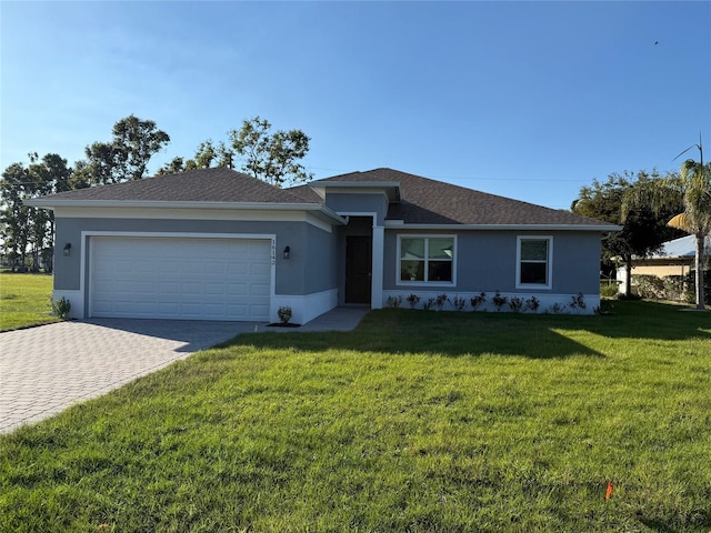 single story home with stucco siding, an attached garage, decorative driveway, and a front yard