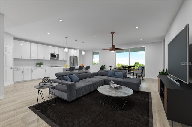 living room with recessed lighting and light wood-style flooring