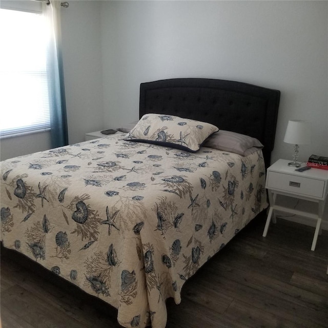 bedroom with wood finished floors