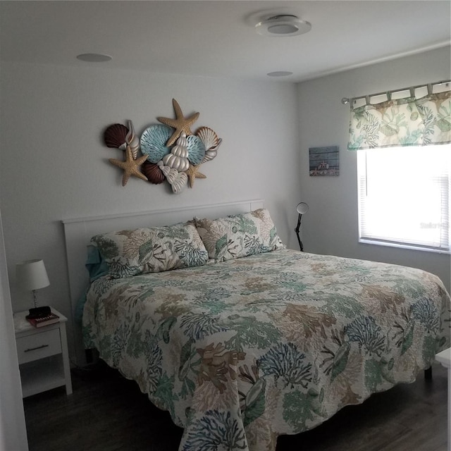 bedroom with wood finished floors