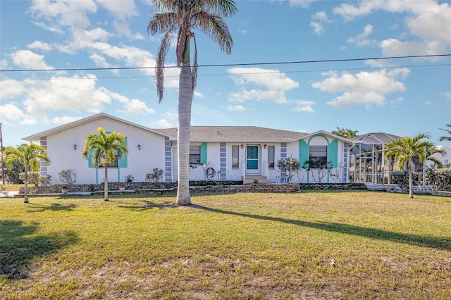 view of front of house featuring a front yard and stucco siding