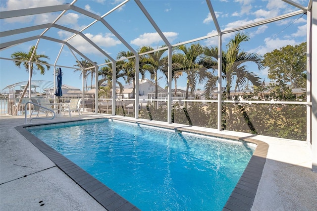 pool with a patio and a lanai