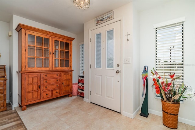 foyer entrance with baseboards