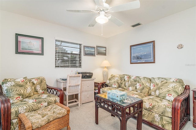 living area with ceiling fan, carpet floors, and visible vents