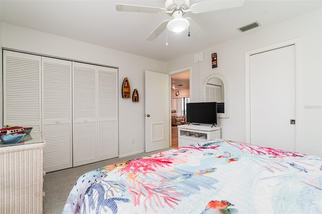 bedroom with carpet floors, a closet, visible vents, ceiling fan, and baseboards