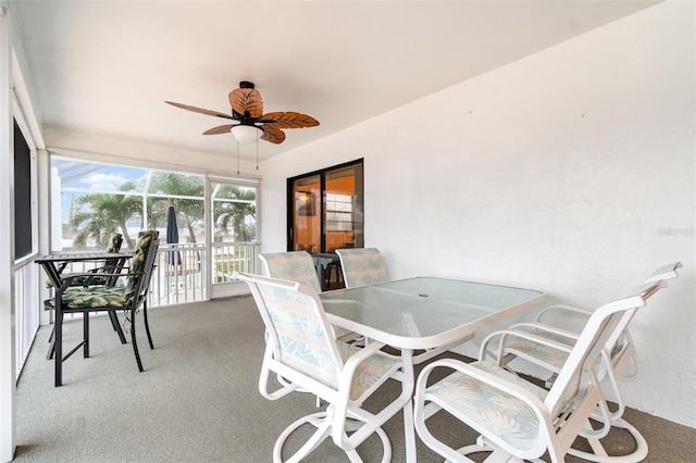 sunroom featuring ceiling fan