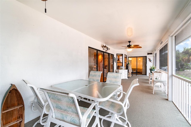 sunroom / solarium with a ceiling fan