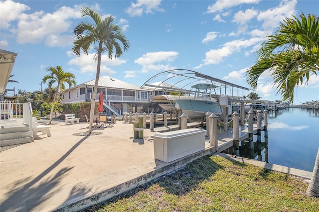 dock area featuring a water view and boat lift