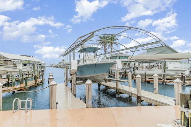 view of dock featuring a water view and boat lift