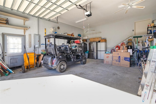 garage with a garage door opener and freestanding refrigerator