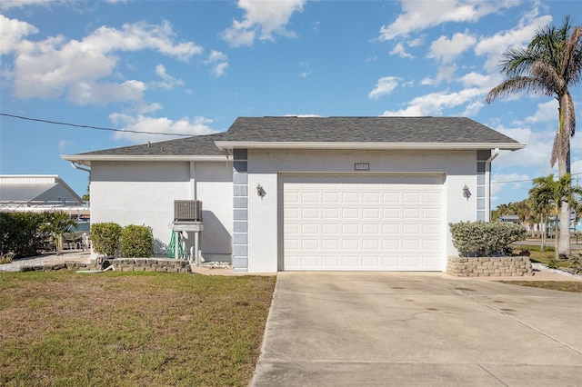 ranch-style house featuring a garage, a shingled roof, a front lawn, and stucco siding