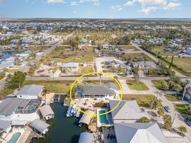 birds eye view of property featuring a water view and a residential view