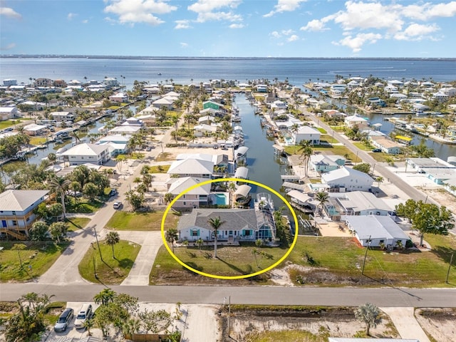 birds eye view of property featuring a water view and a residential view