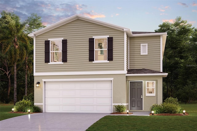 view of front of home with a yard, driveway, an attached garage, and stucco siding