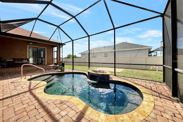 view of swimming pool with glass enclosure, a patio area, a hot tub, and fence