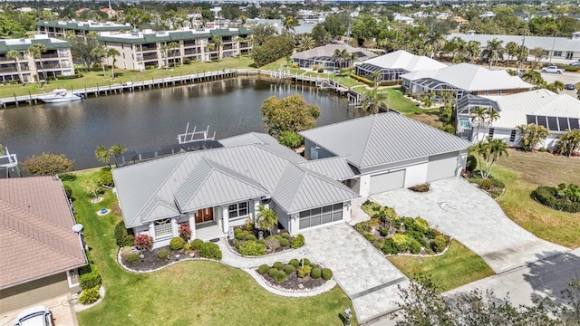 birds eye view of property with a residential view and a water view