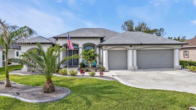 view of front of property featuring an attached garage, concrete driveway, roof with shingles, stucco siding, and a front lawn