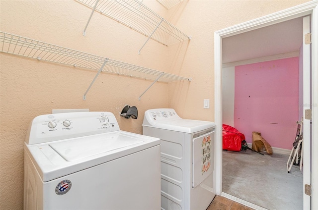 laundry room featuring laundry area and washing machine and clothes dryer