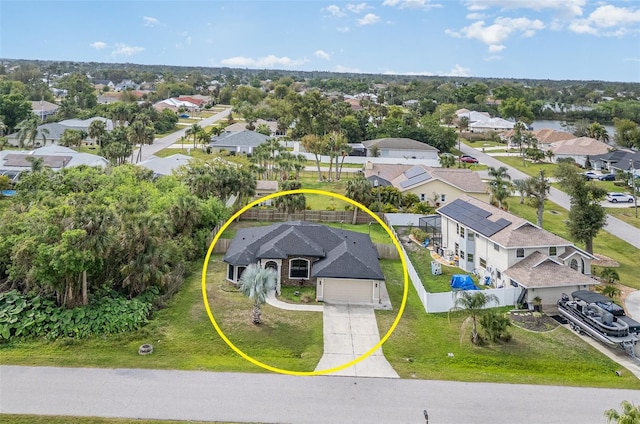 birds eye view of property with a residential view