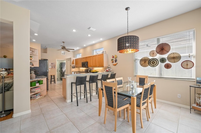 dining area featuring recessed lighting, ceiling fan, baseboards, and light tile patterned floors