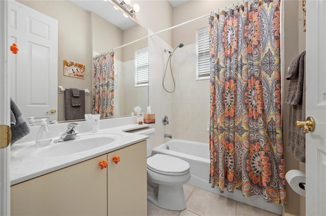 full bathroom featuring toilet, tile patterned flooring, shower / tub combo with curtain, and vanity