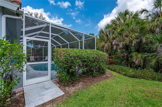 view of yard with a lanai and an outdoor pool