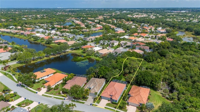 bird's eye view with a water view and a residential view