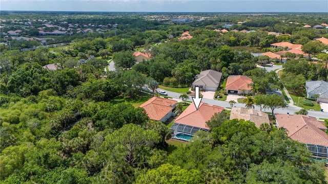 aerial view featuring a residential view and a view of trees