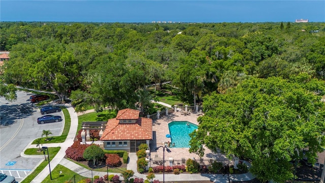 bird's eye view featuring a wooded view